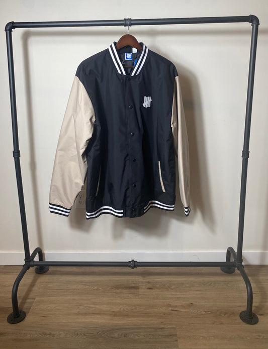 THE UNDEFEATED TECH VARSITY JACKET SIZE XL